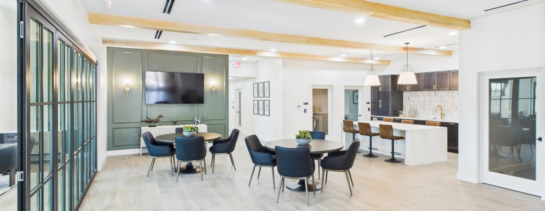 Clubhouse with furniture and green accent wall