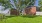 Fenced in grassy area for bark park