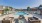 Pool with sundeck and firepit lounge